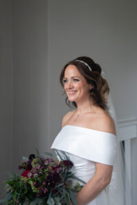 Close-up of bridal makeup featuring luminous skin, softly defined eyes and a natural pink lip